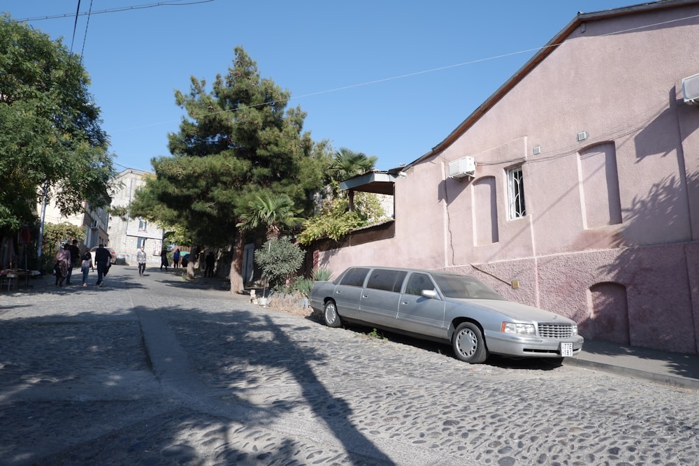 a silver car parked on the side of a road