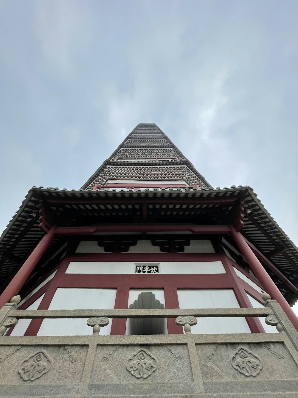 a tall tower with a bell on top of it