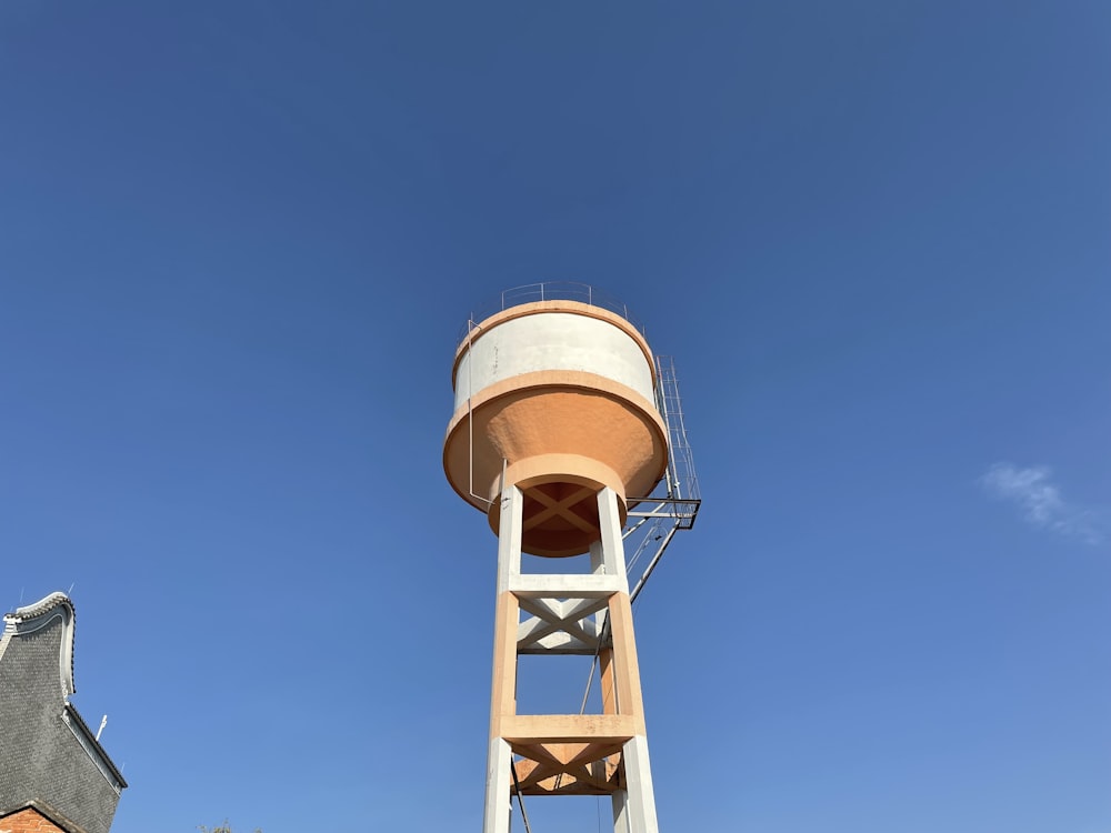 a tall water tower sitting next to a building