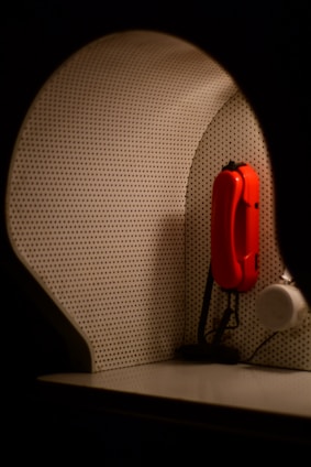 A warm, inviting telephone with subtle mystical symbols in the background.