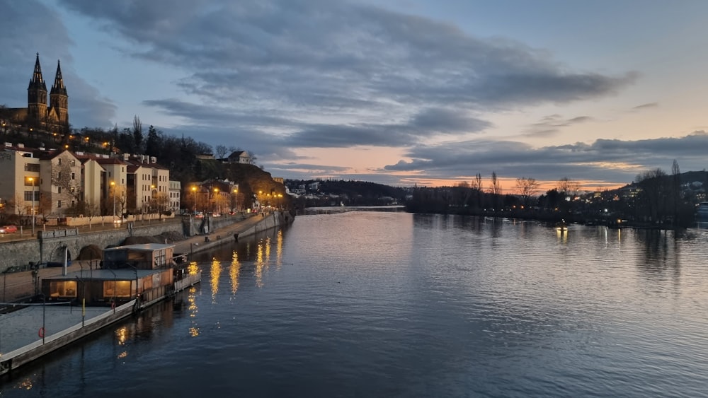 a body of water with a city in the background