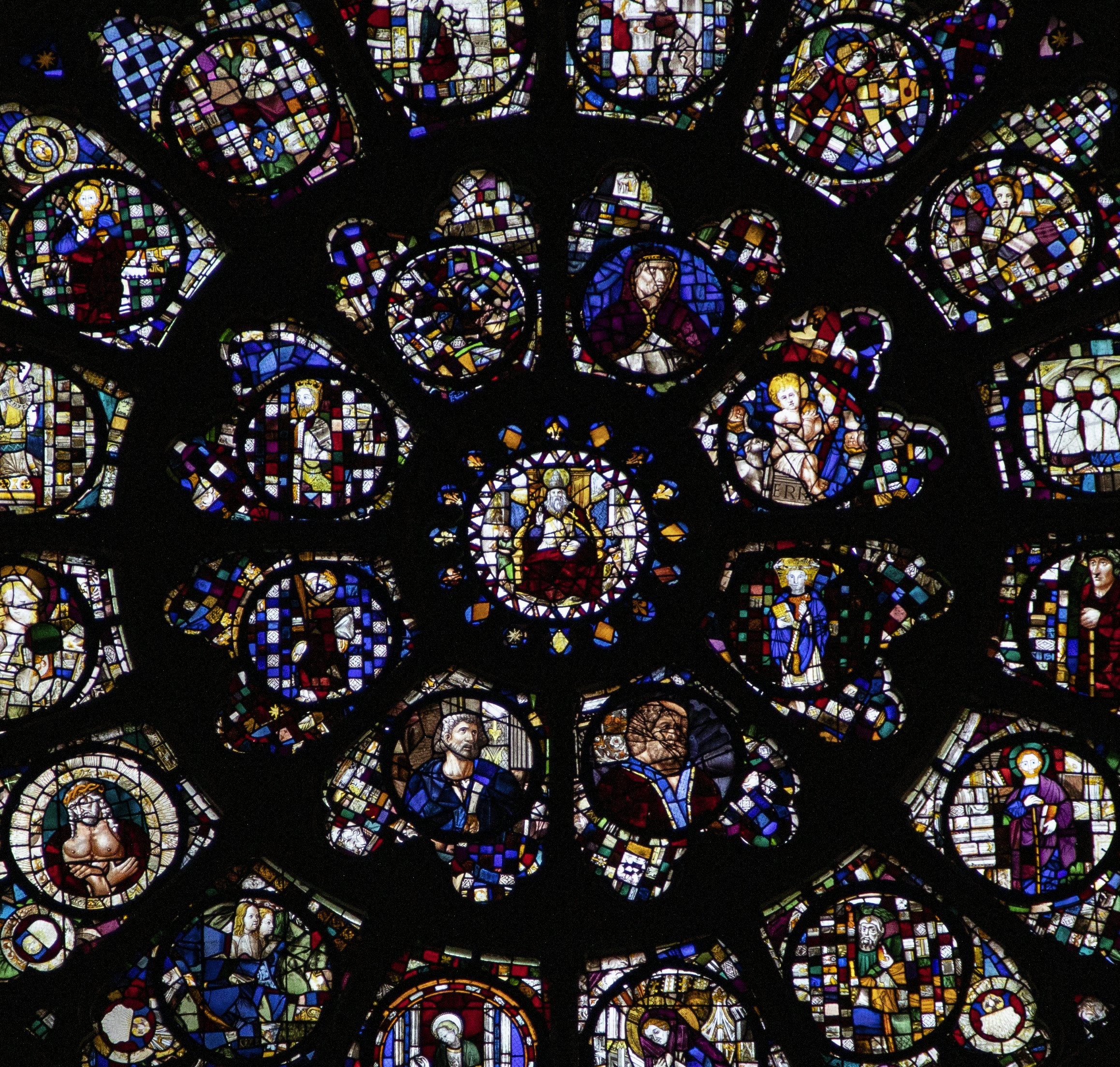 Stunning close up shot of the artistic glass located in a church in Toulouse, France.by Jas Rolyn