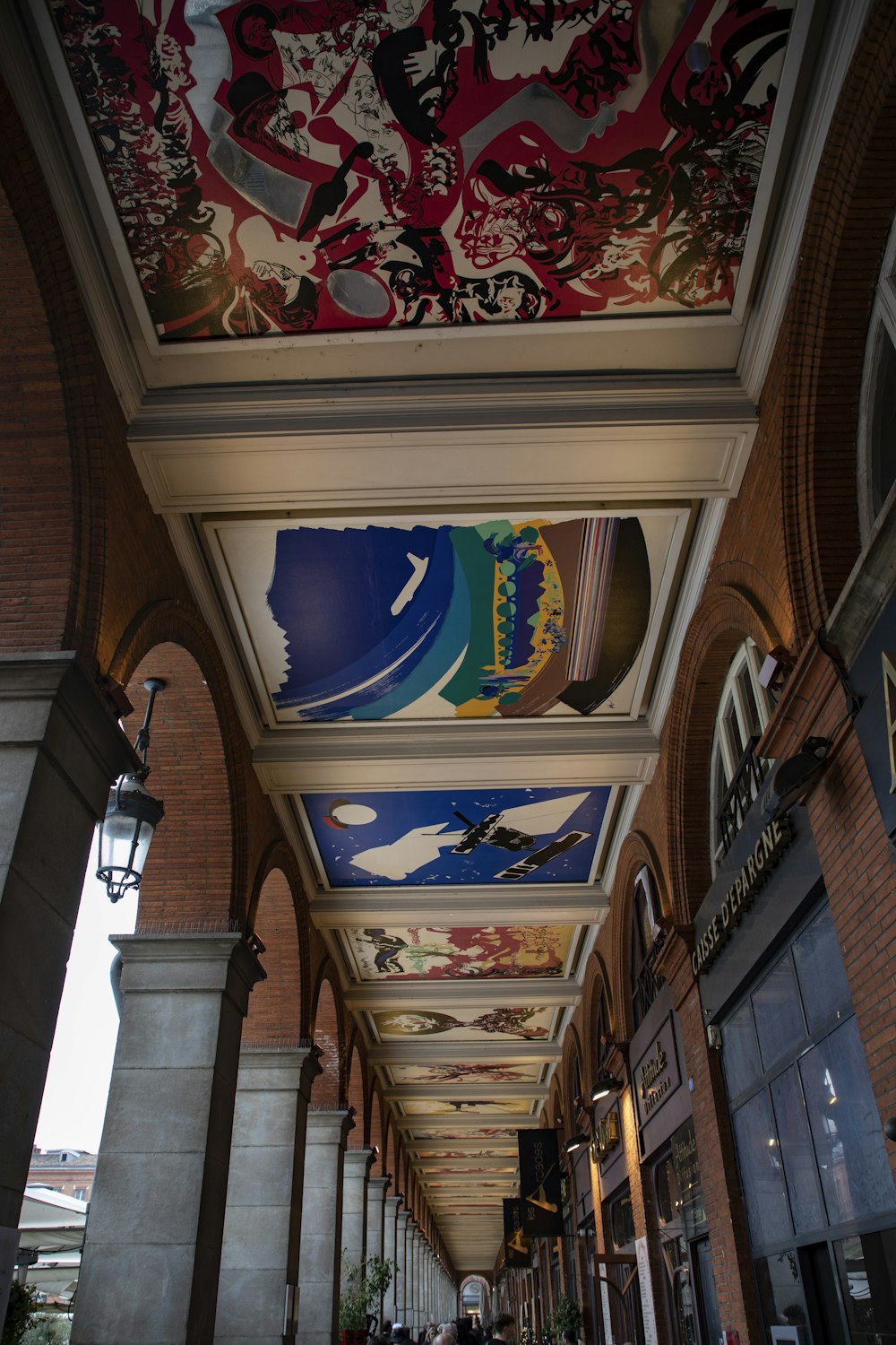 the ceiling of a building with a mural on it