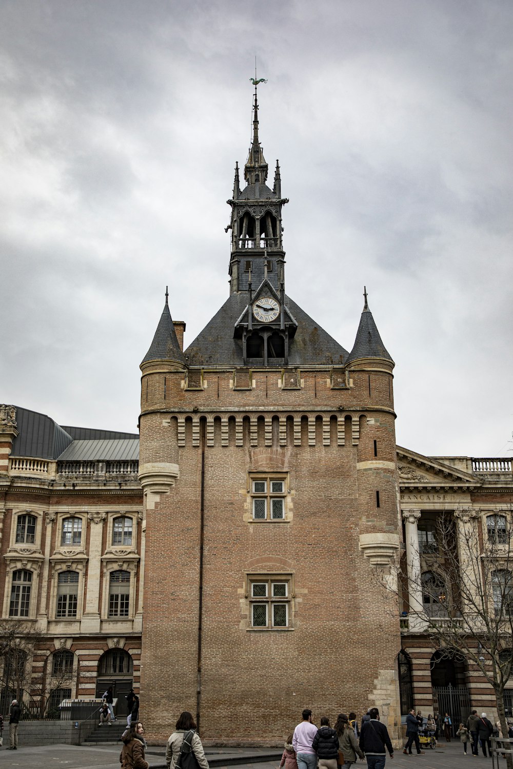 a large brick building with a clock tower