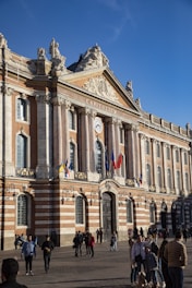 a group of people standing in front of a building