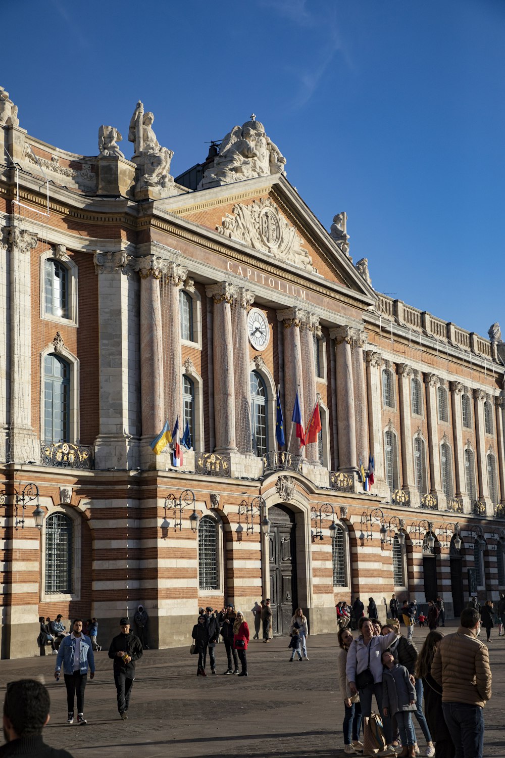 a group of people standing in front of a building