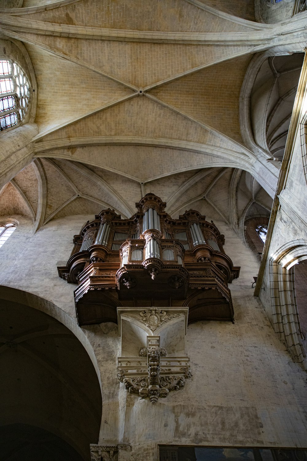 a cathedral with a large organ in the middle of it