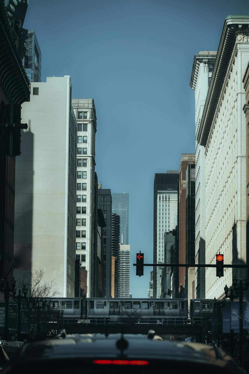 a city street with traffic lights and tall buildings