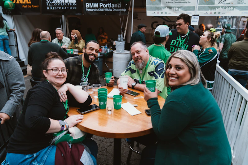Attendees connecting and laughing over cups of latte art