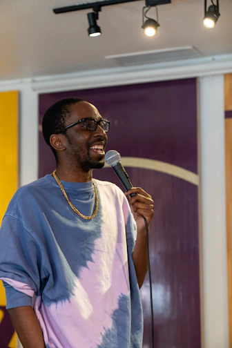 a man standing in front of a microphone