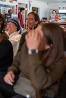 Casual candid of Elisa sharing a moment with clients from retail and hospitality sectors.