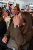 A couple sharing a joyful moment at a café.