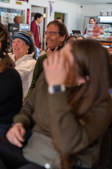 A couple sharing a joyful moment at a café.