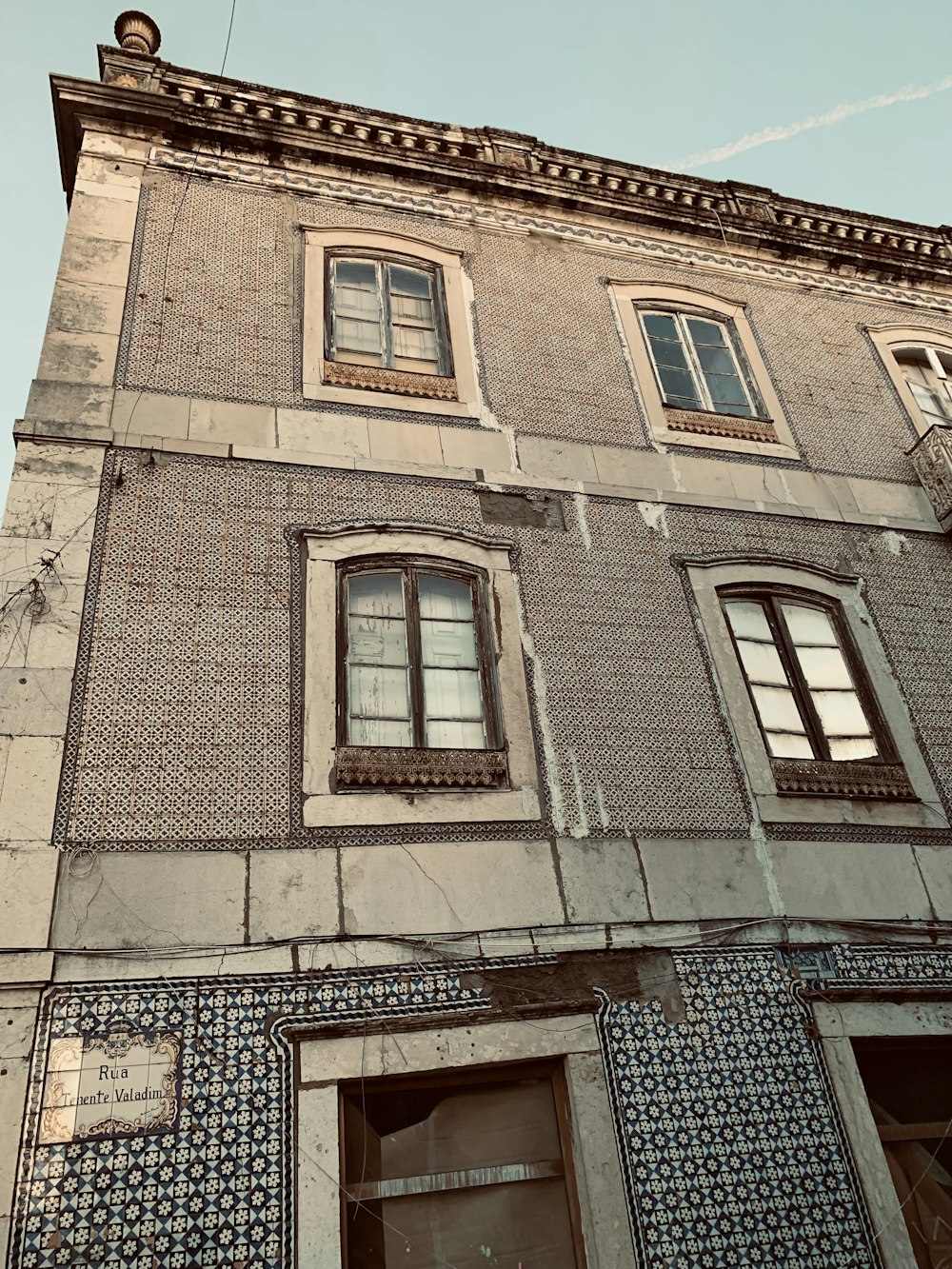 an old building with a clock on the side of it