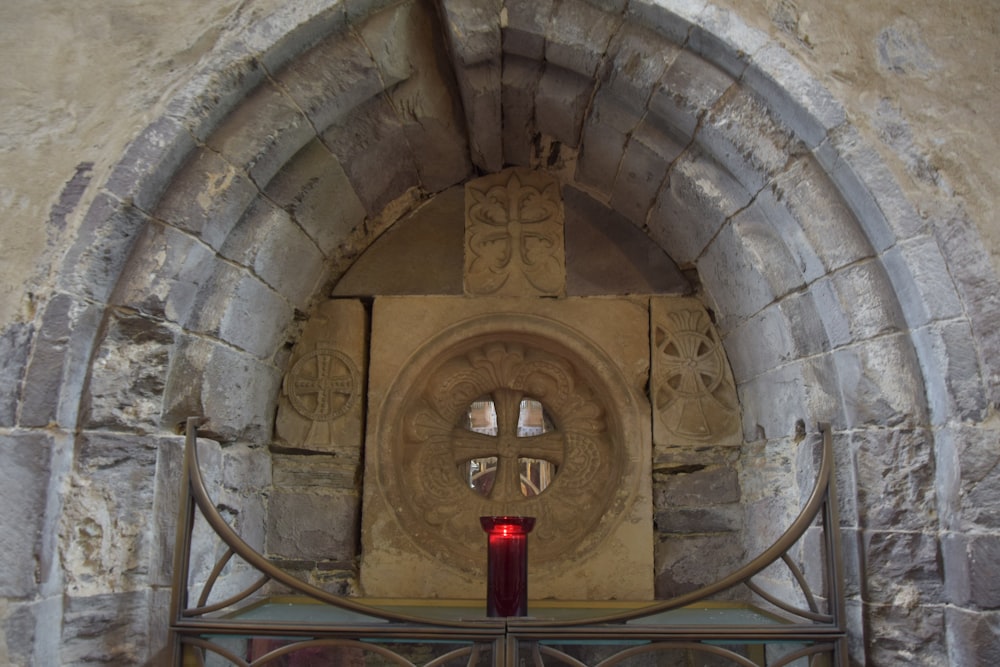 a gate with a red light in the middle of it