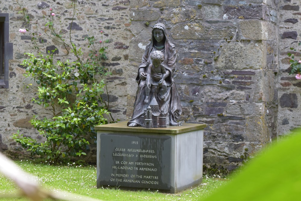 a statue of a woman holding a child