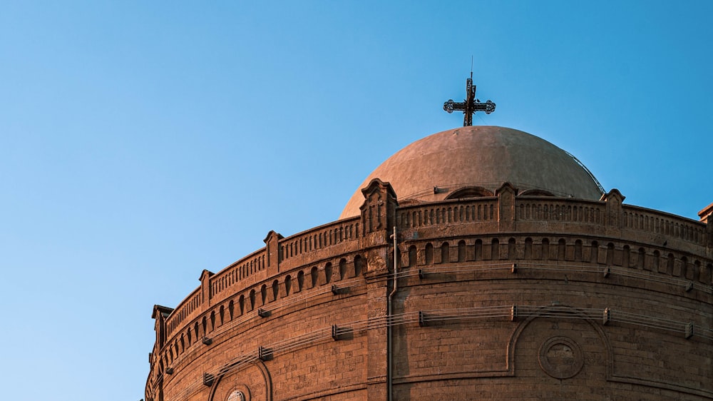 a large building with a cross on top of it