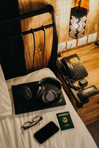 A cozy bedroom scene with a credit card and smartphone ready for payment.