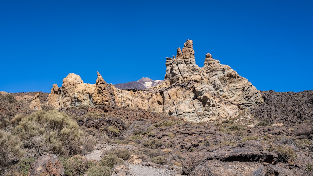 a group of rocks in the middle of a desert