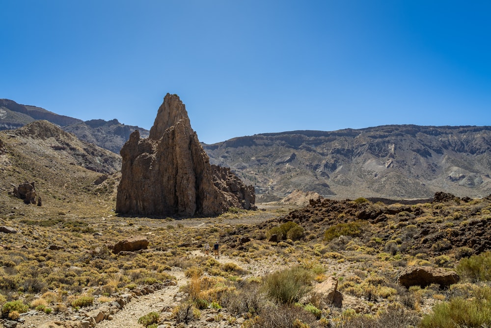 a rocky outcropping in the middle of a desert