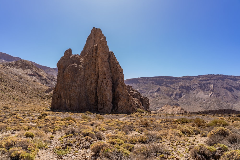 a rocky outcropping in the middle of a desert