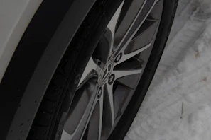 A set of winter tires with snowflake symbols, ready for icy roads.