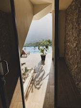 a view of a pool from inside a house