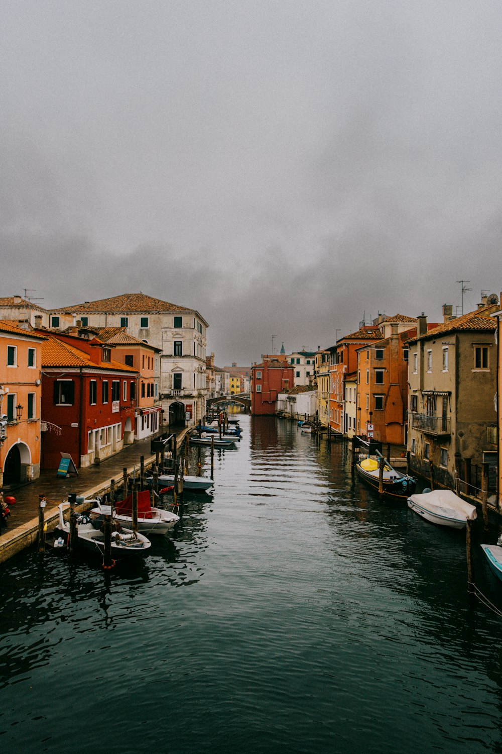 a body of water surrounded by buildings and boats