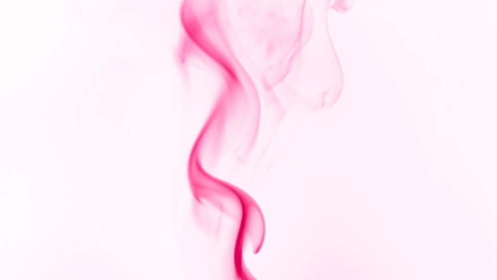 a pink smoke swirls across a white background