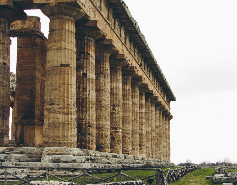 a row of stone pillars sitting next to each other