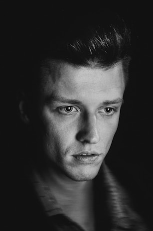 Minimalist studio portrait of a guest with smooth, fitness-inspired hair reflecting calm confidence.