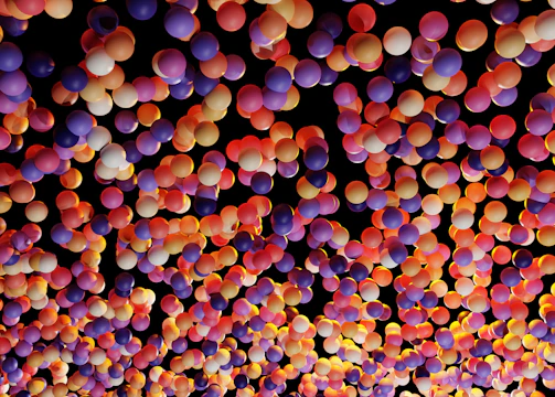 Colorful balloons surrounding a photo booth at a lively corporate event.