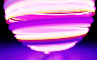 a purple and yellow object with a black background