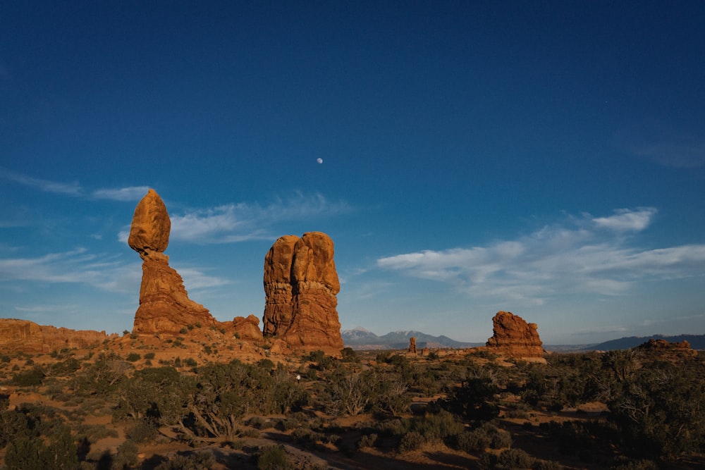 a large rock formation in the middle of a desert