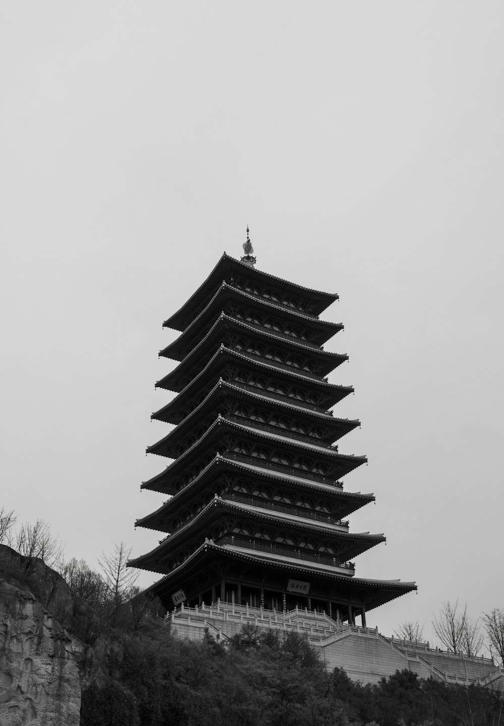 a tall building sitting on top of a hill
