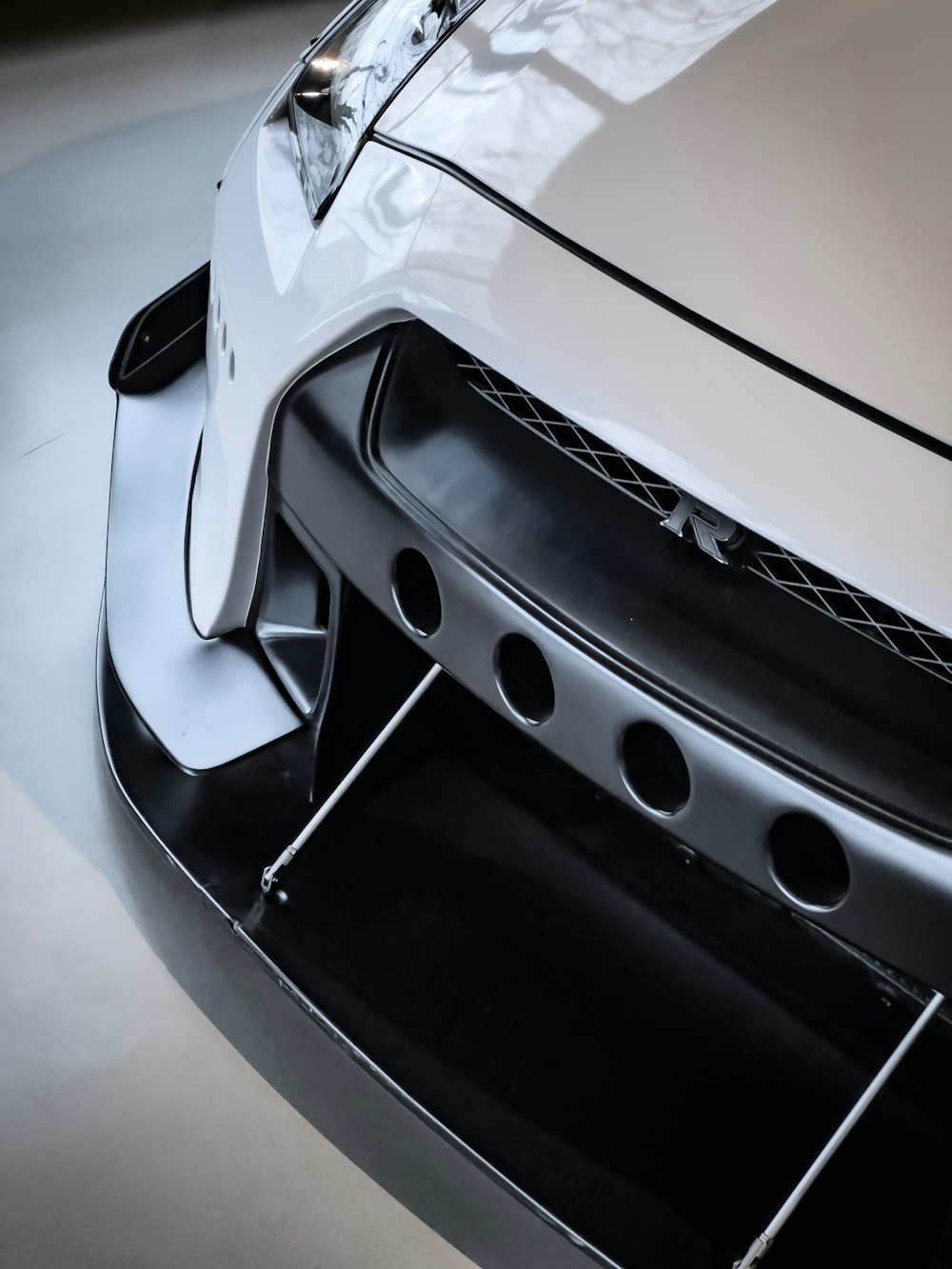 a close up of the front bumper of a sports car