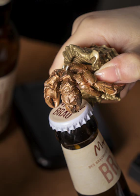 Bartender using the multi-functional Flash Bar Pro to open a beer bottle with ease.