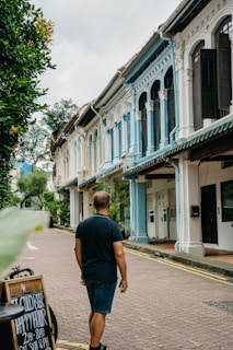 A quiet corner in Penang Island with colorful colonial buildings and tropical greenery.