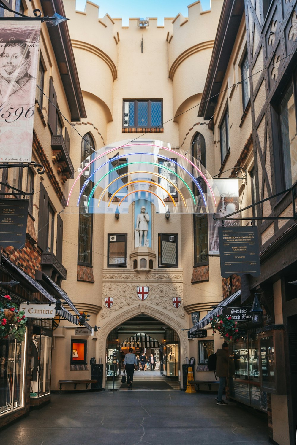 the inside of a building with people walking around