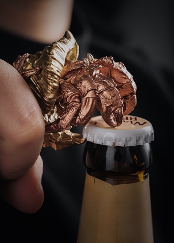 A detailed shot of a unique Red Bull can opener with vintage design.