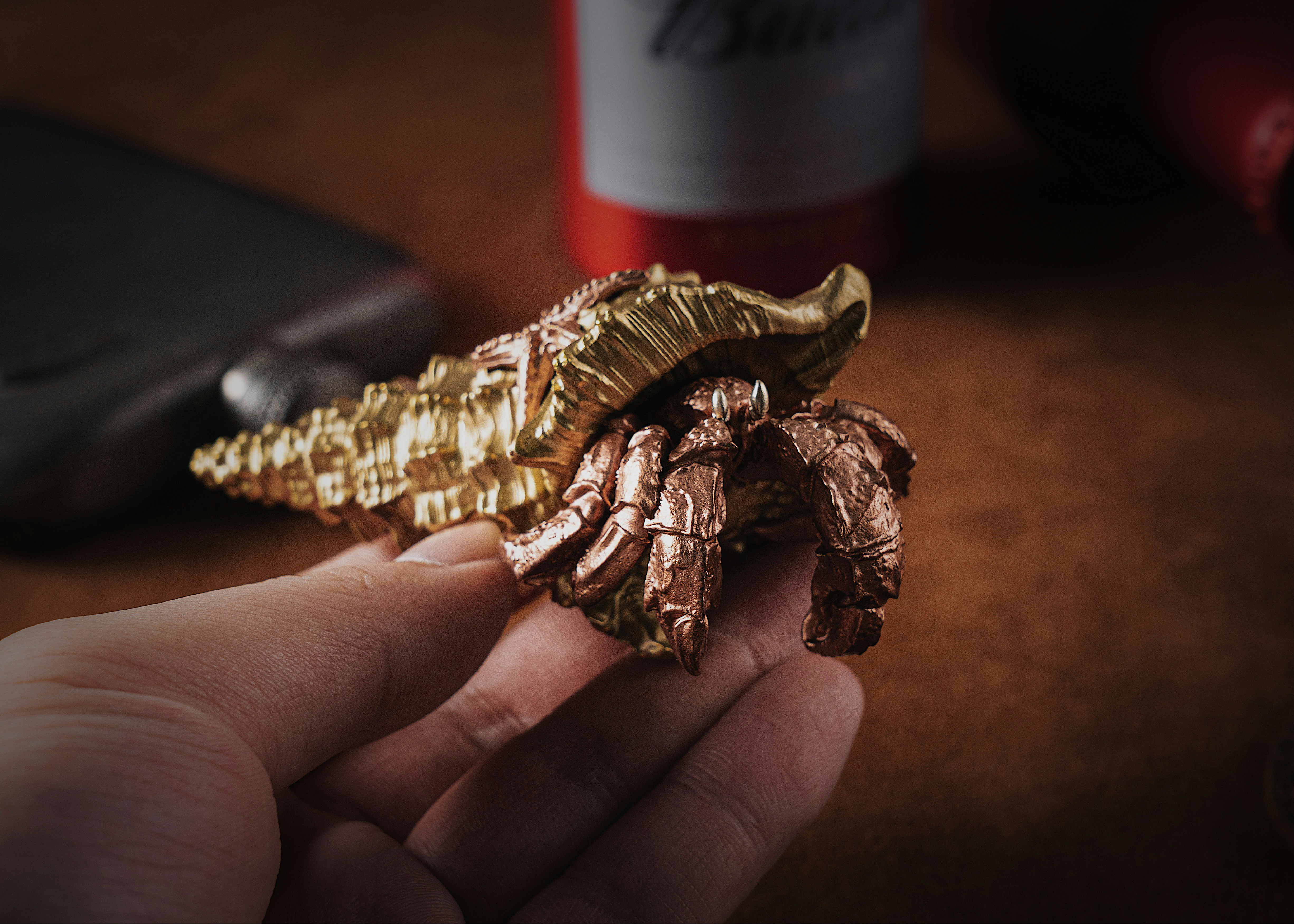 a person holding a piece of gold foil in their hand