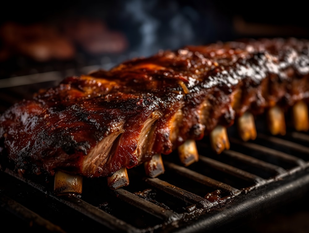 a rack of ribs cooking on a grill