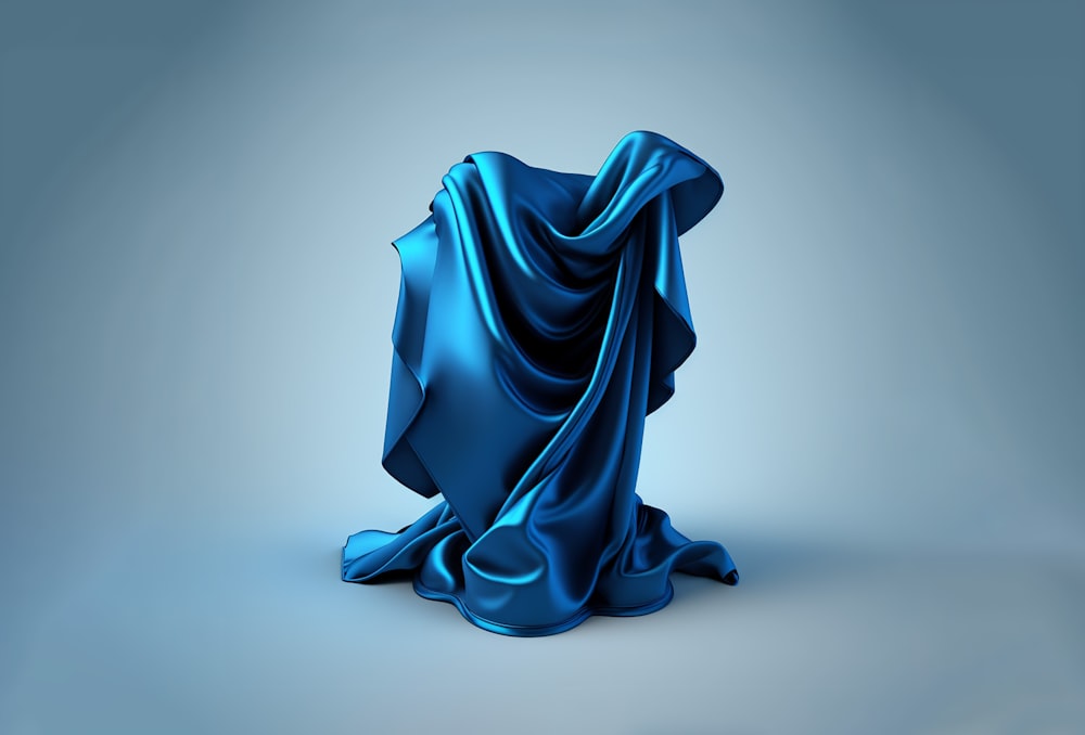 a blue cloth draped over a chair on a gray background
