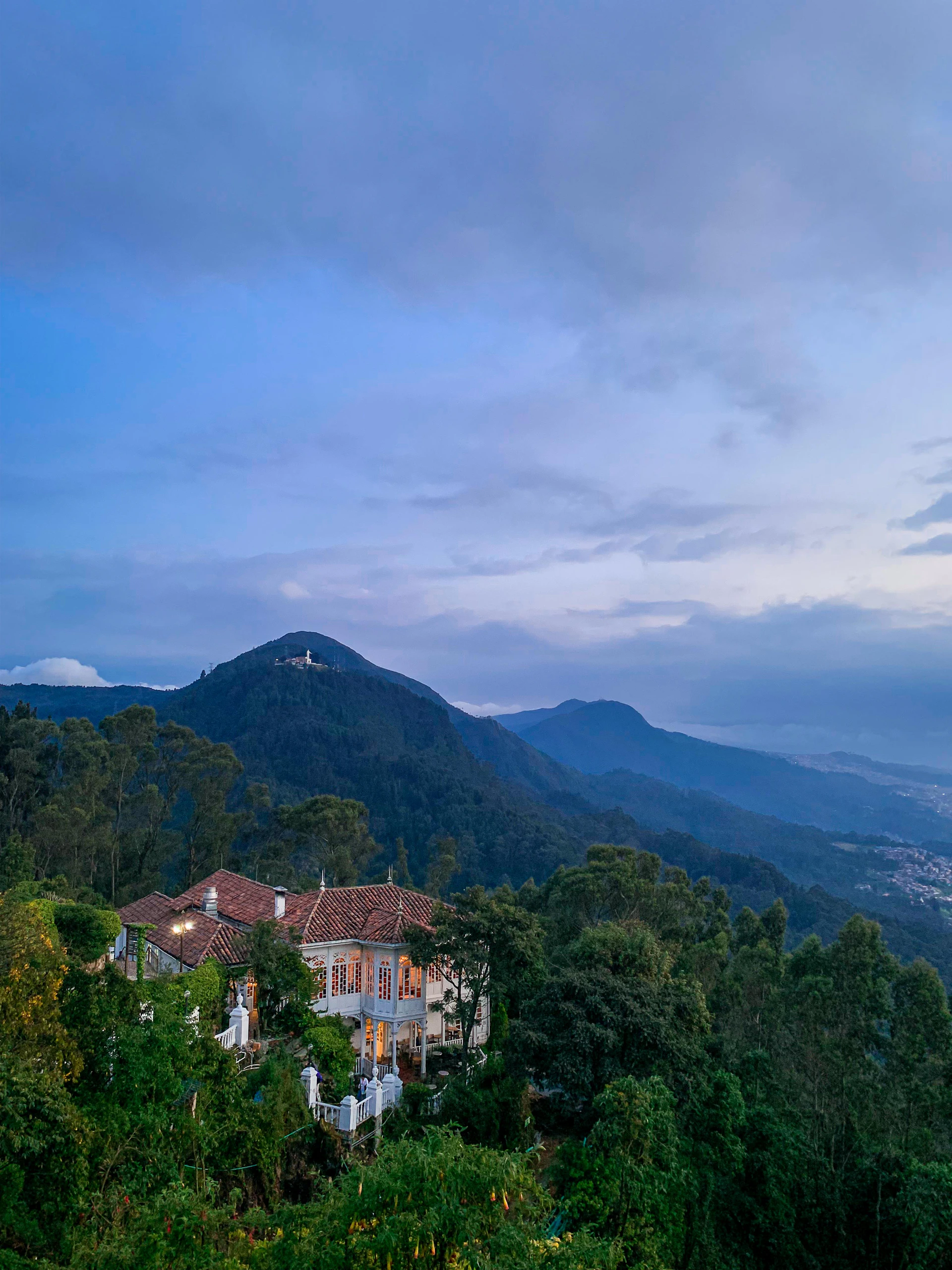 woman wearing yellow long-sleeved dress under white clouds and blue sky during daytime