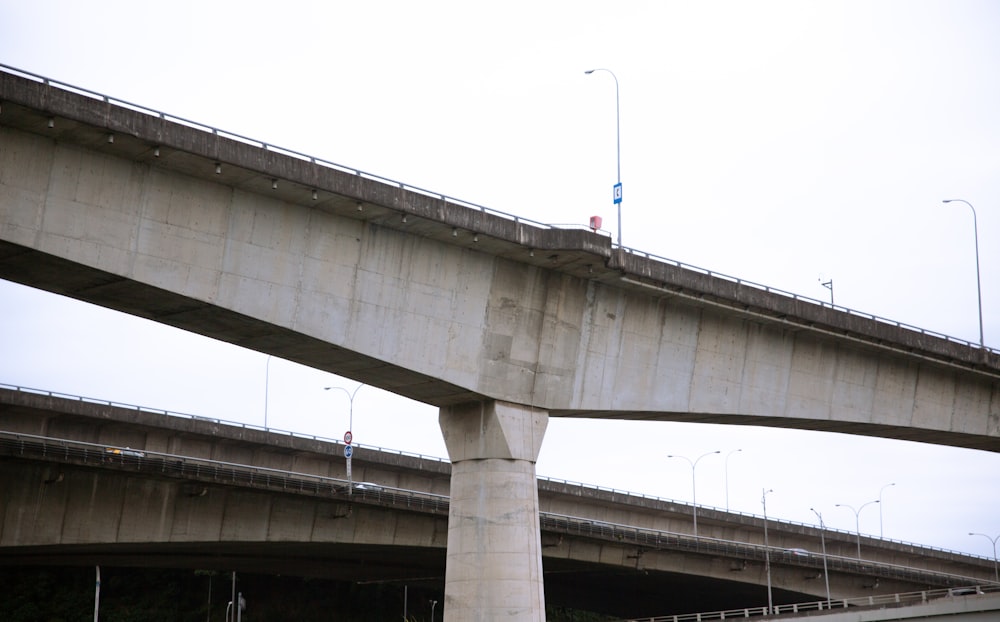 a large bridge over a river with a traffic light on it