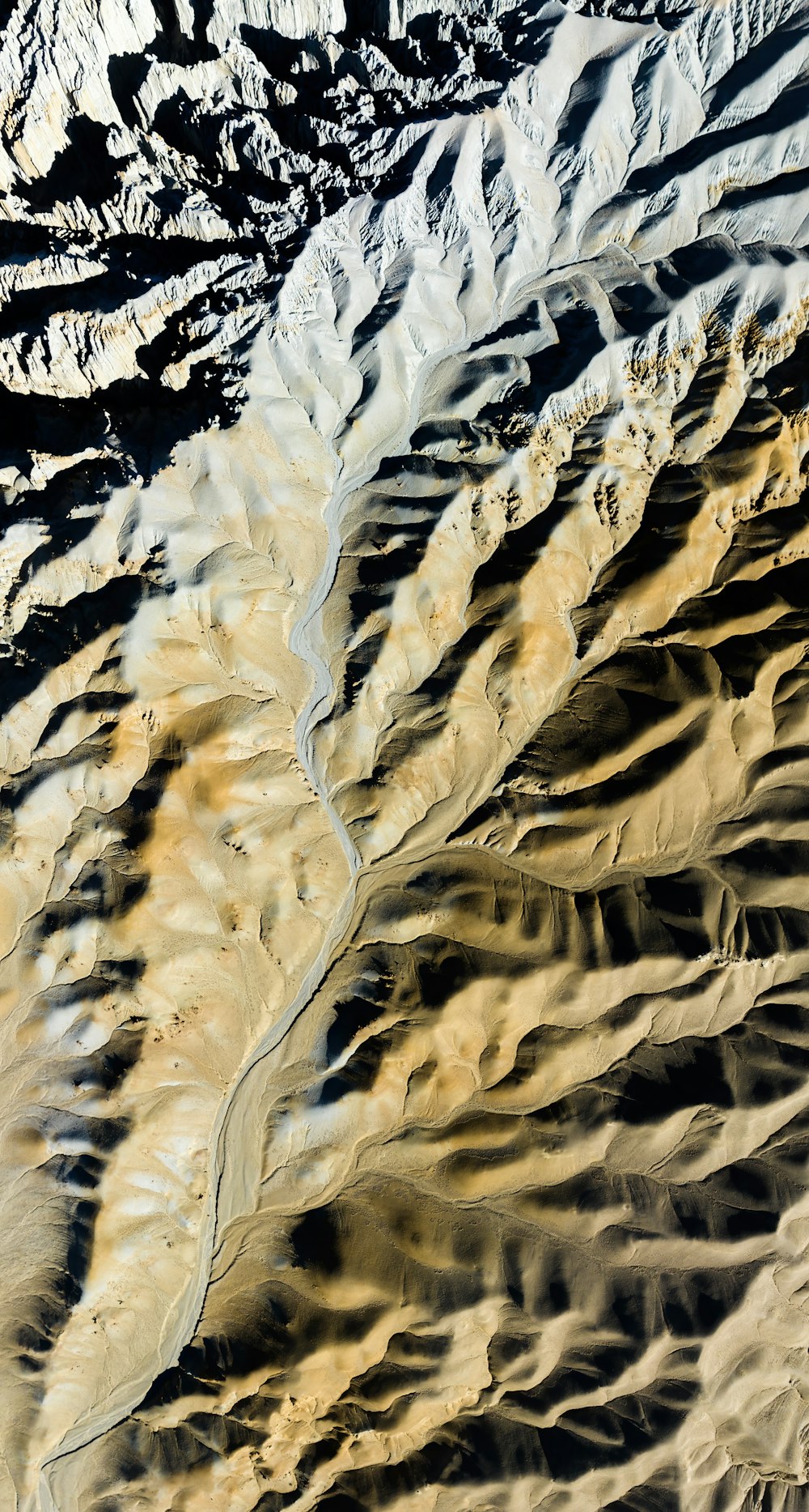 an aerial view of a mountain range in the desert