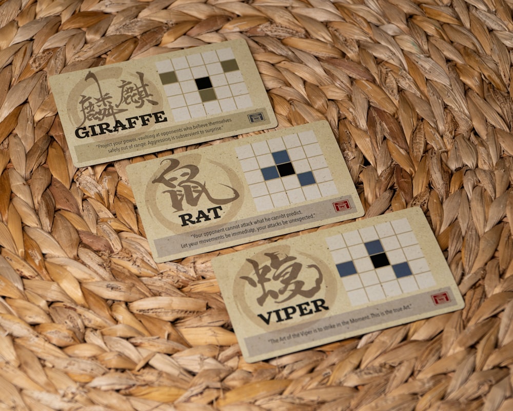 a couple of business cards sitting on top of a woven basket