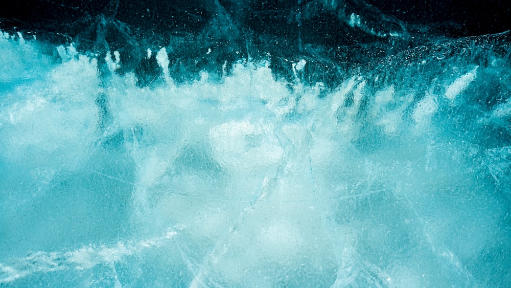 a painting of water and ice on a black background