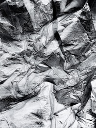 A close-up of shiny aluminium scrap pieces ready for recycling.