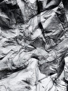 A close-up of shiny aluminium scrap pieces ready for recycling.